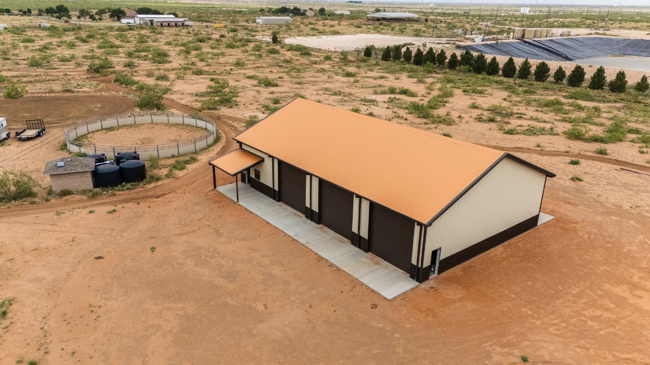 Drone view of a metal ag building built by Best In The West Construction in West Texas